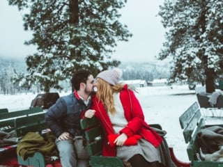 man and woman on a sleigh