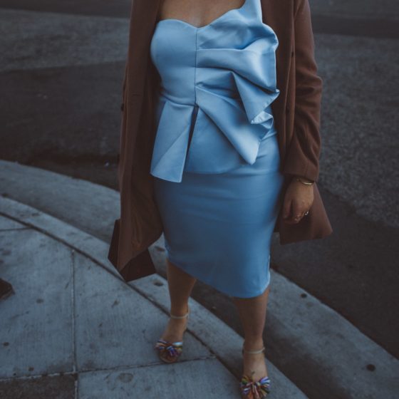 Woman wearing baby blue fan dress