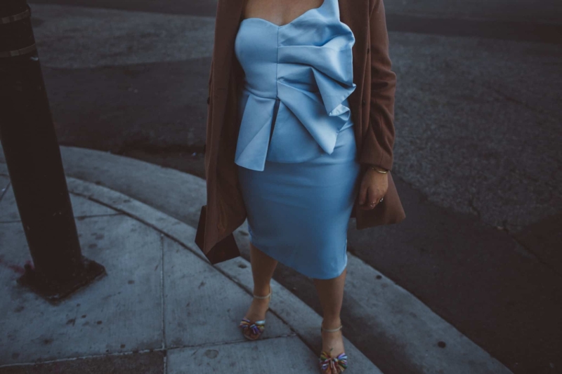Woman wearing baby blue fan dress