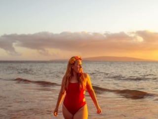 wearing my red swimsuit on Kiwakapu beach in maui
