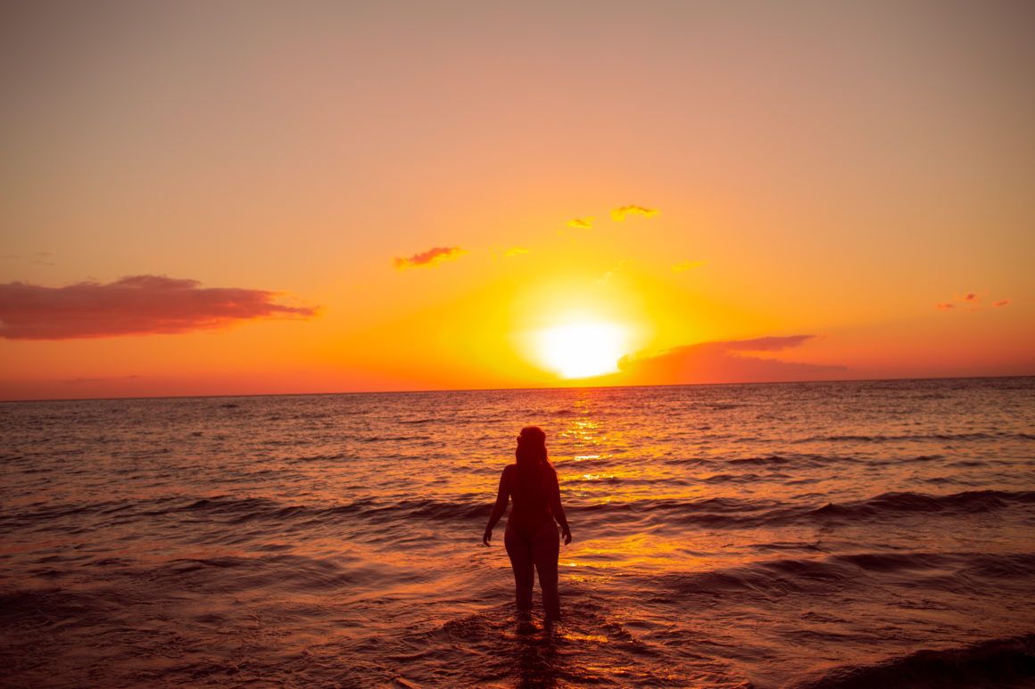 wearing my red swimsuit on Kiwakapu beach in maui