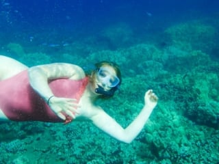 Snorkel Maui Hawaii Cruise - woman snorkeling in coral reef