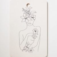 Woman With Flowers Cutting Board