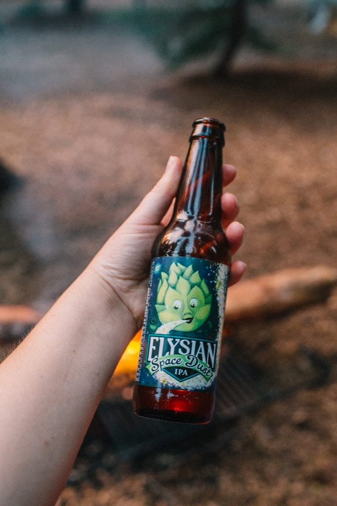 drinking a bottle of Elysian Space Dust IPA around th campfire