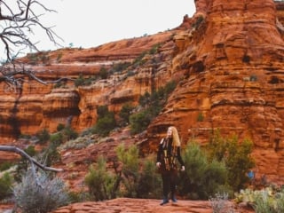 Kara of Whimsy Soul standing on Sedona Arizona Red Rocks