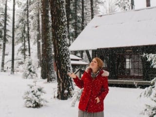 Kara in her red winter coat at Sleeping Lady Mountain resort in Leavenworth, Washington