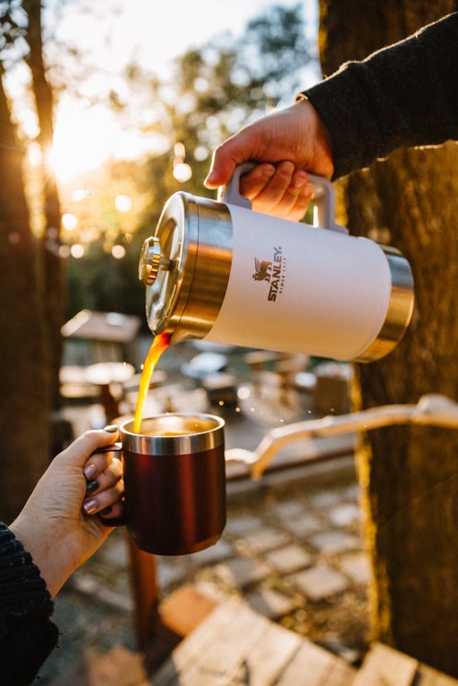 https://whimsysoul.com/wp-content/uploads/2021/01/Whimsy-Soul-Glamping-Packing-List-Pouring-coffee-from-Stanley-French-Press-101.jpg